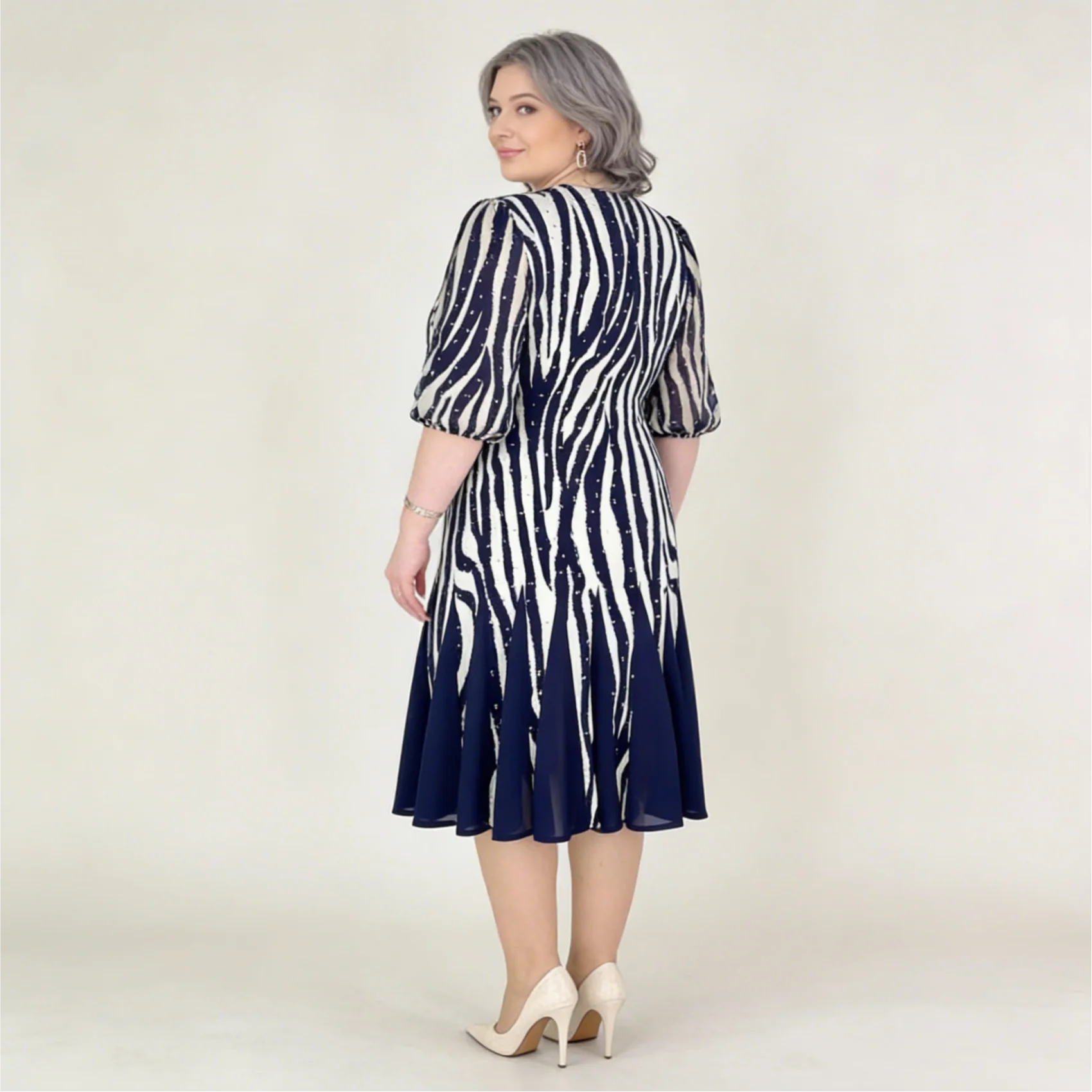 Elegant women's dress with a patterned design - airy mesh sleeves, slimming cut